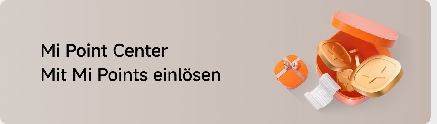 Mi Point Center, um Mi Points einzulösen. Eine orangefarbene Box enthält goldene Tokens und einen kleinen Zettel, daneben befindet sich eine kleine Geschenkbox.